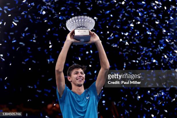 Alexei Popyrin of Australia holds the winner's trophy after his victory in Men's Singles Final match against Alexander Bublik of Kazakhstan on day...