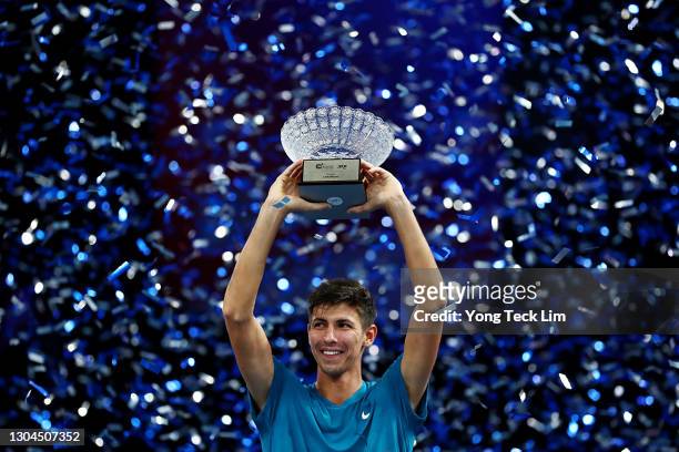 Alexei Popyrin of Australia celebrates with the champion's trophy after his Men's Singles Final match victory over Alexander Bublik of Kazakhstan on...