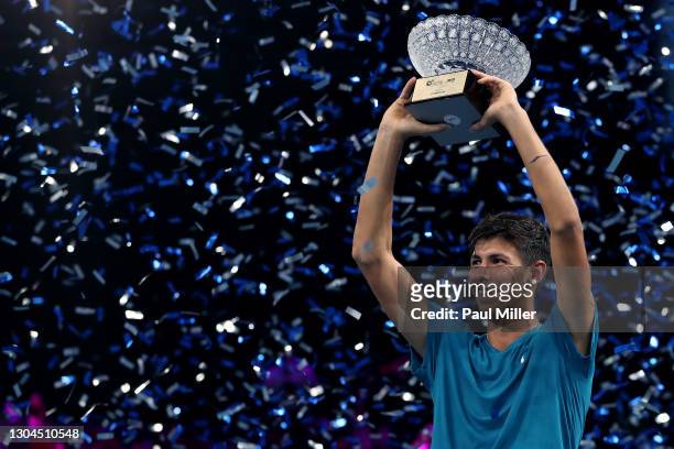 Alexei Popyrin of Australia holds the winner's trophy after his victory in Men's Singles Final match against Alexander Bublik of Kazakhstan on day...