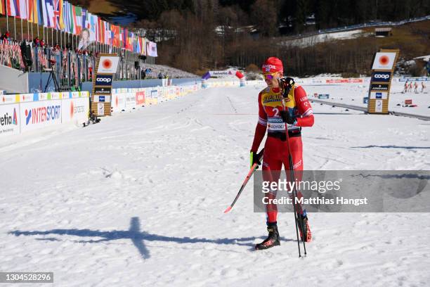 Alexander Bolshunov of Russian Ski Federation looks dejected as he walks off the track following the Men's Cross Country Team Sprint Finals at the...