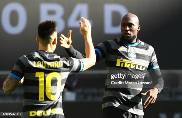 Romelu Lukaku of Internazionale celebrates with team mate Lautaro Martinez after scoring their side's first goal during the Serie A match between FC...