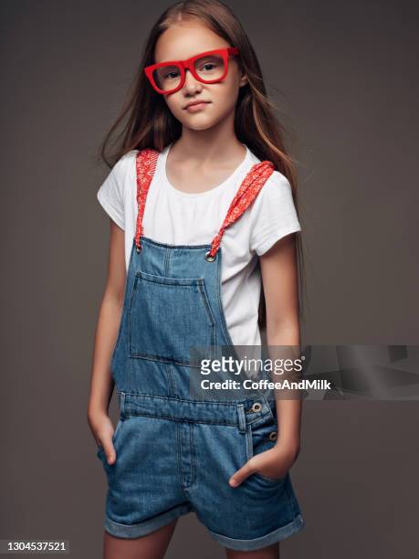 little girl wearing bib overalls - sweet little models stock pictures, royalty-free photos & images