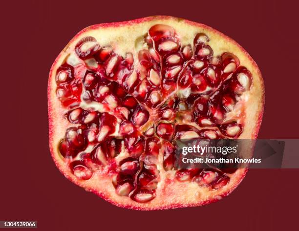 sliced red pomegranate - pomegranate stock pictures, royalty-free photos & images