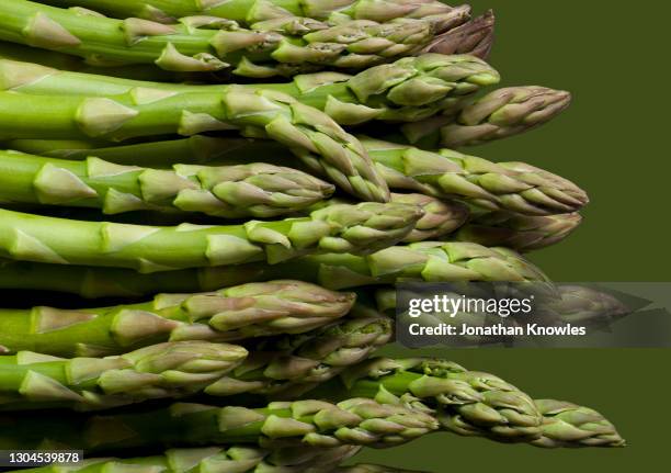 green asparagus tips - food coloured background stock pictures, royalty-free photos & images