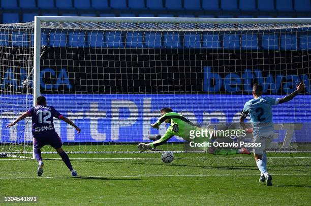 Fabian Orellana of Real Valladolid scores their side's first goal past Ruben Blanco of Celta Vigo during the La Liga Santander match between RC Celta...