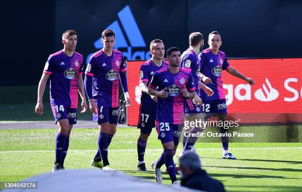 Fabian Orellana of Real Valladolid is congratulated by team mates Ruben Alcaraz, Roque Mesa and Lucas Olaza after scoring their side's first goal...
