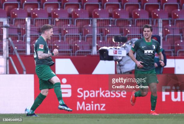Andre Hahn of FC Augsburg celebrates after scoring their side's first goal during the Bundesliga match between 1. FSV Mainz 05 and FC Augsburg at...