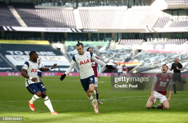 Gareth Bale of Tottenham Hotspur celebrates after scoring their sides fourth goal with team mate Serge Aurier during the Premier League match between...