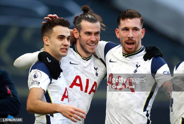 Gareth Bale of Tottenham Hotspur celebrates with team mates Sergio Reguilon and Pierre-Emile Hojbjerg after scoring their side's fourth goal during...