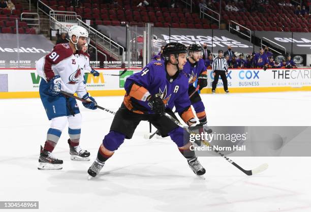 Niklas Hjalmarsson of the Arizona Coyotes looks for the puck against the Colorado Avalanche at Gila River Arena on February 27, 2021 in Glendale,...