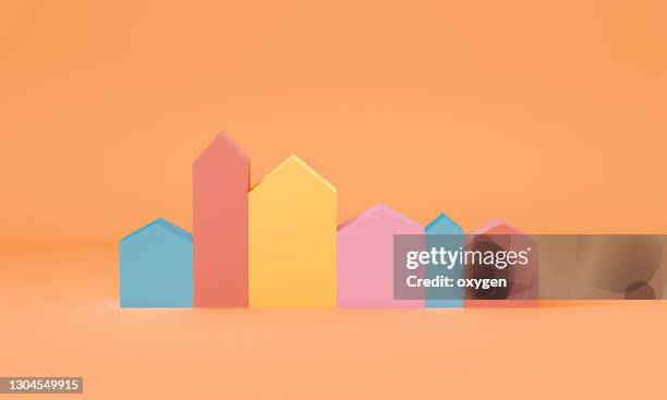 3d rendering small colorful houses icon on yellow baackground - house sale stock-fotos und bilder