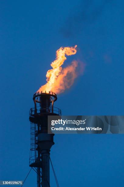 flare at oil refinery - refinery stock pictures, royalty-free photos & images