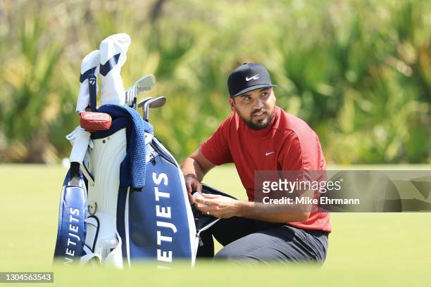Jason Day of Australia looks on from the putting green during the final round of World Golf Championships-Workday Championship at The Concession on...