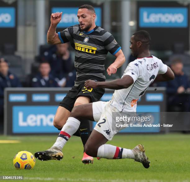 Danilo D Ambrosio of FC Internazionale is challenged by Cristian Zapata of Genoa CFC during the Serie A match between FC Internazionale and Genoa CFC...