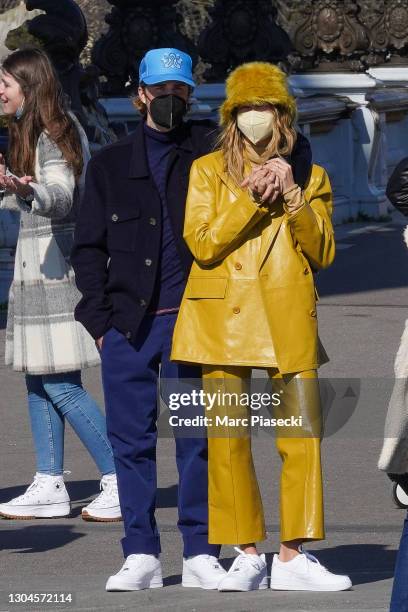 Singer Justin bieber and wife Hailey Baldwin Bieber are seen strolling on the Pont Alexandre III on February 28, 2021 in Paris, France.