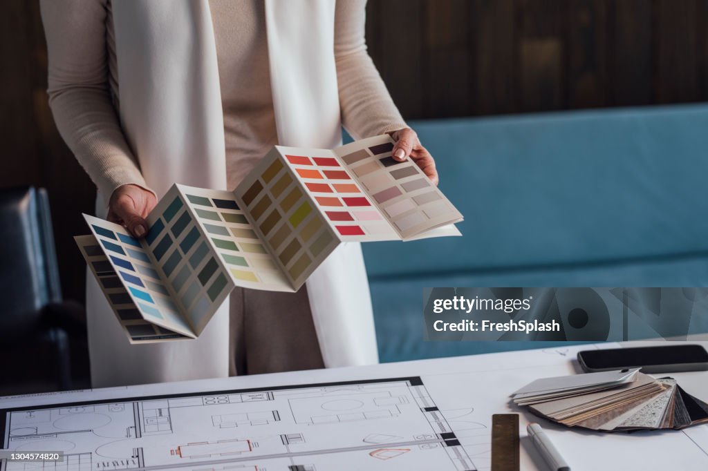 Choosing the Right Color: Anonymous Female Architect Working on a Project in her Office