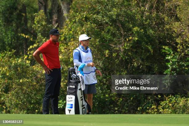 Tony Finau of the United States and his caddie wait on the seventh hole during the final round of World Golf Championships-Workday Championship at...