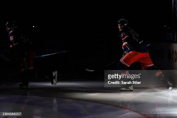 Libor Hajek and Kevin Rooney of the New York Rangers take the ice before the first period against the Boston Bruins at Madison Square Garden on...