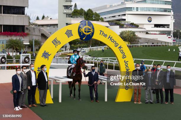 Jockey Matthew Poon Ming-fai and trainer Frankie Lor Fu-chuen celebrate after All For St Paul's winning the Race 6 Yuen Chau Tsai Handicap at Sha Tin...