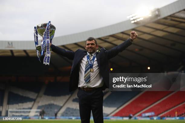 St Johnstone manager Callum Davidson is seen with the trophy during the Betfred Cup Final match between Livingston and St Johnstone at Hampden Park...
