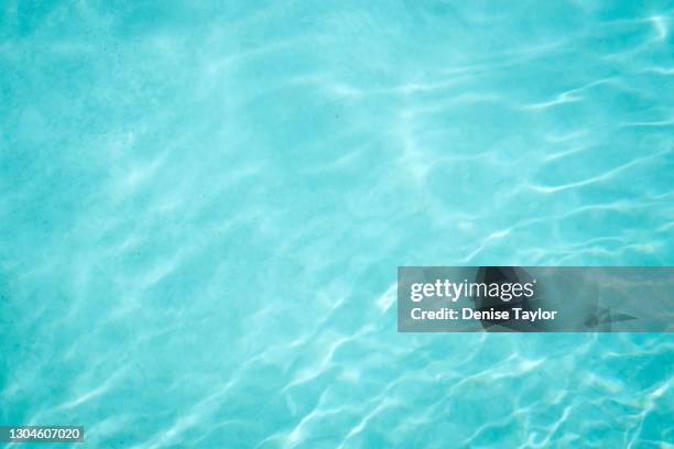 pale blue swimming pool water - water surface stock pictures, royalty-free photos & images