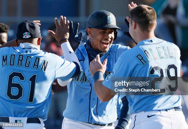 Julio Rodríguez of the Seattle Mariners reacts after hitting a walk-off single in the ninth inning to defeat the San Diego Padres 5-4 during the MLB...