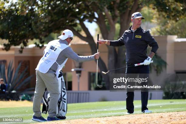 Chris DiMarco grabs a putter on the 15th green during the final round of the Cologuard Classic at the Catalina Course of the Omni Tucson National...