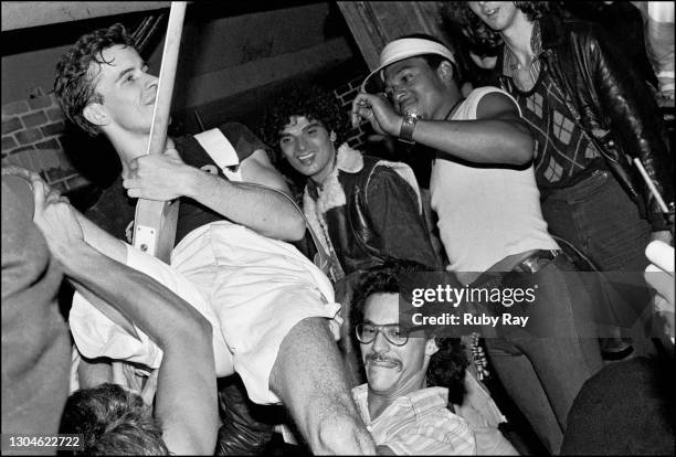 Bob Mothersbaugh of Devo jumps into the happy crowd. 1977