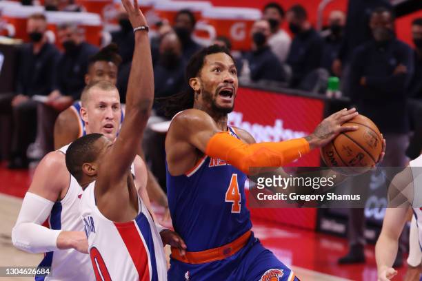Derrick Rose of the New York Knicks drives to the basket against Dennis Smith Jr. #0 of the Detroit Pistons during the first half at Little Caesars...