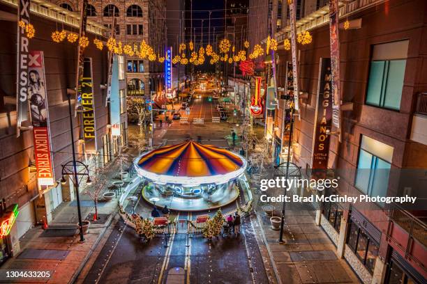 christmas carousel in motion downtown denver - denver city stock pictures, royalty-free photos & images