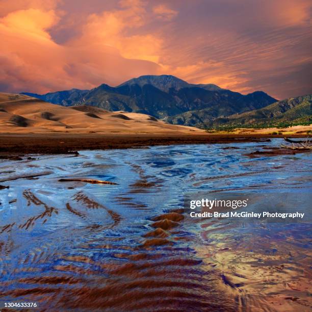 sunset at great sand dunes national park - great sand dunes national park stock-fotos und bilder