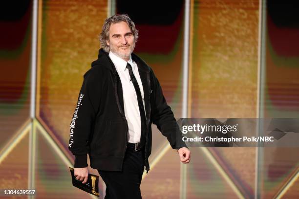 78th Annual GOLDEN GLOBE AWARDS -- Pictured: Joaquin Phoenix walks onstage at the 78th Annual Golden Globe Awards held at The Beverly Hilton and...