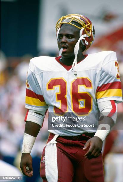 Timmy Smith of the Washington Redskins looks on against the Philadelphia Eagles during an NFL football game September 18, 1988 at RFK Stadium in...