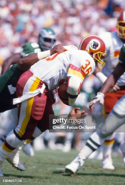 Timmy Smith of the Washington Redskins carries the ball against the Philadelphia Eagles during an NFL football game September 18, 1988 at RFK Stadium...