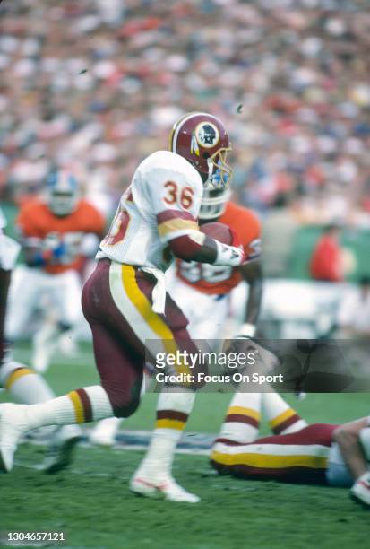 Timmy Smith of the Washington Redskins carries the ball against the Denver Broncos during Super Bowl XXII on January 31, 1988 at Jack Murphy Stadium...