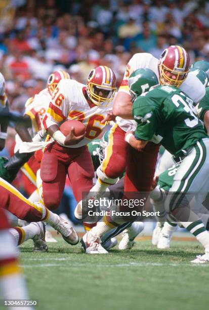 Timmy Smith of the Washington Redskins carries the ball against the Philadelphia Eagles during an NFL football game September 18, 1988 at RFK Stadium...