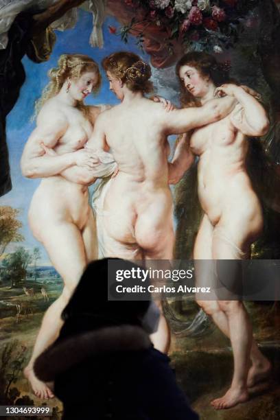 Woman observes Rubens painting 'The Three Graces' belonging to the exhibition 'Mythological Passions' at the Prado Museum on March 01, 2021 in...