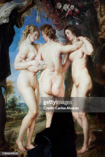 Woman observes Rubens painting 'The Three Graces' belonging to the exhibition 'Mythological Passions' at the Prado Museum on March 01, 2021 in...