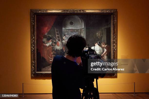 Journalist observes Diego Velazquez painting 'The Fable of Arachne or The Spinners' belonging to the exhibition 'Mythological Passions' at the Prado...