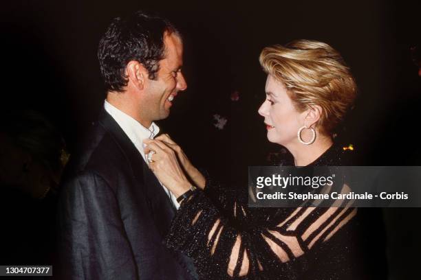 Christian Vadim and Catherine Deneuve attend the « Nino Cerruti » Diner during the 47th Annual Cannes Film Festival on May, 1994 in Cannes, France.