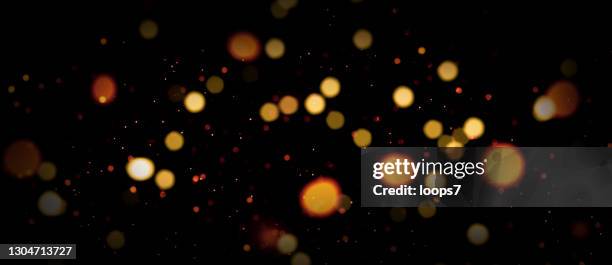 defocused lights and particles abstract background - disco lights background stock illustrations