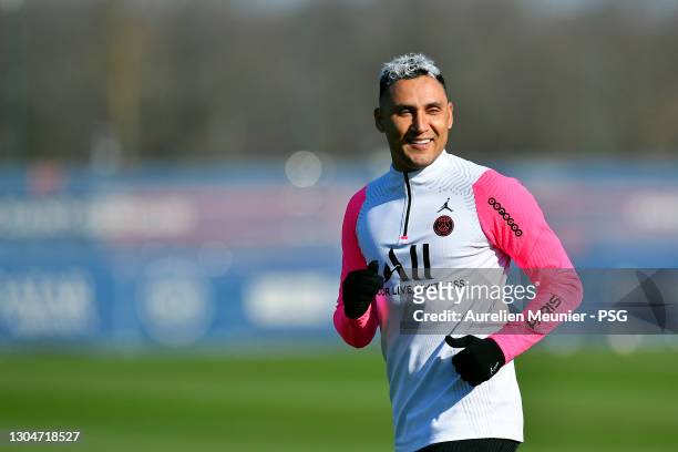 Keylor Navas warms up during a Paris Saint-Germain training session at Ooredoo center during on March 01, 2021 in Paris, France.