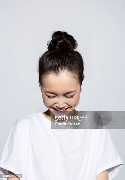 portrait of happy asian young woman - woman white t shirt stock pictures, royalty-free photos & images