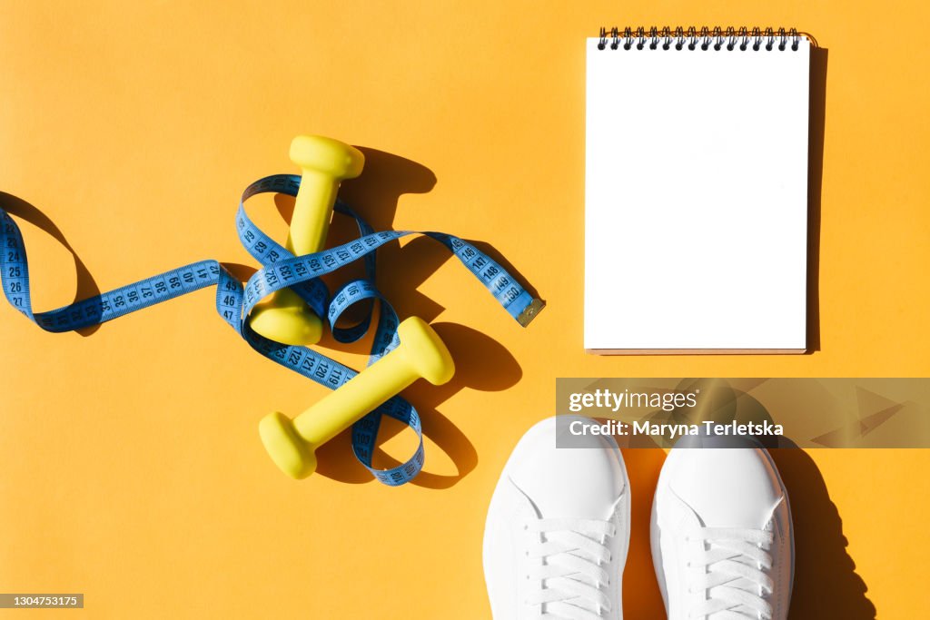 Sports flat lay on an orange background.