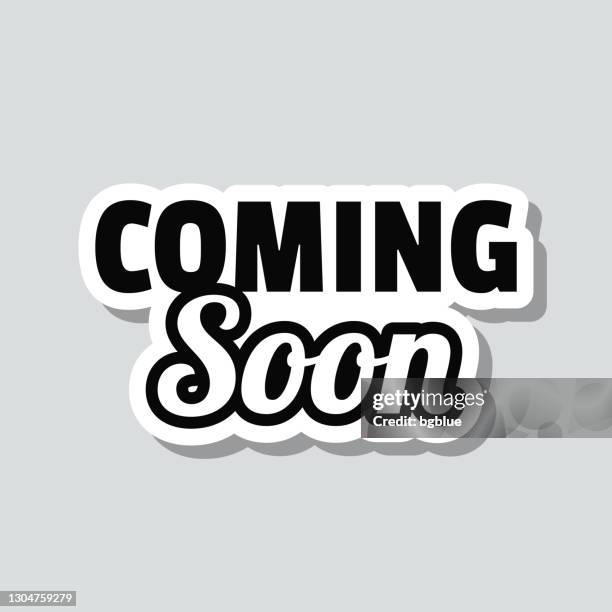 coming soon. icon sticker on gray background - coming soon stock illustrations