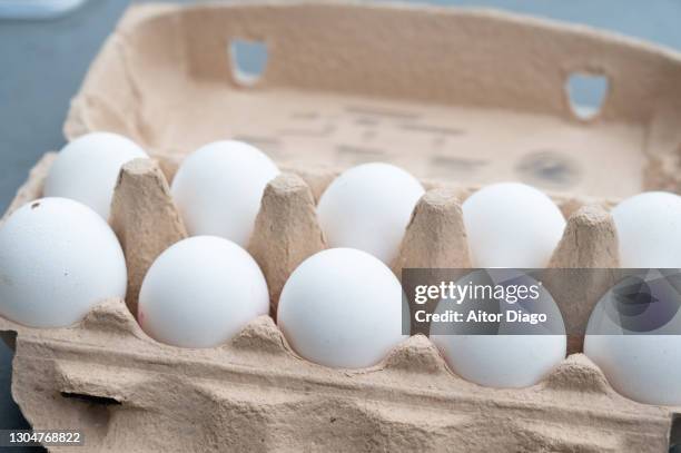 carton full of white eggs. - use by label ストックフォトと画像