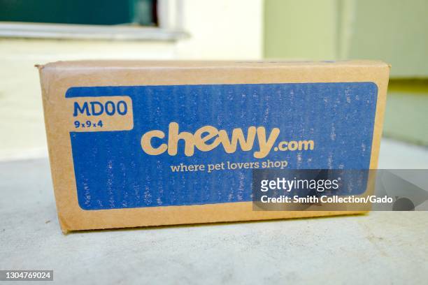Close up of a Chewy.com box from pet-product online retailer Chewy, resting on a light-colored countertop, February 17, 2021.