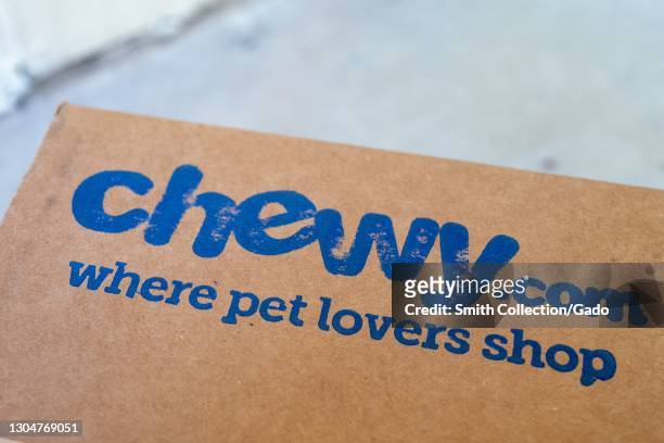 Close up of a "Chewy.com where pet lovers shop" logo on a box from pet-product online retailer Chewy, February 17, 2021.