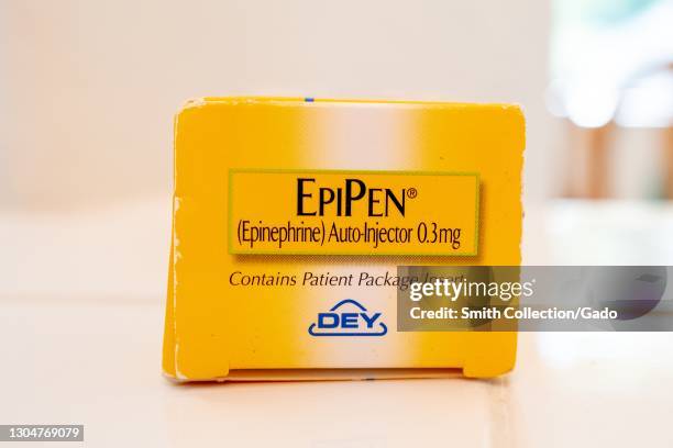 Close-up of a yellow "EpiPen" branded epinephrine autoinjector box end with a Dey Pharma logo, February 17, 2021.
