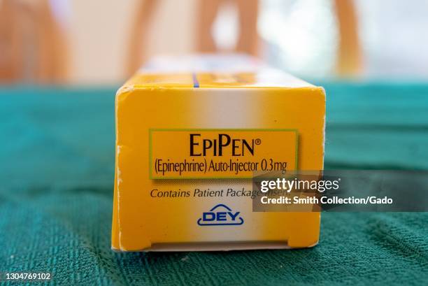 Close up of a yellow, epinephrine autoinjector box-end with "EpiPen" and Dey Pharma logos, February 17, 2021.